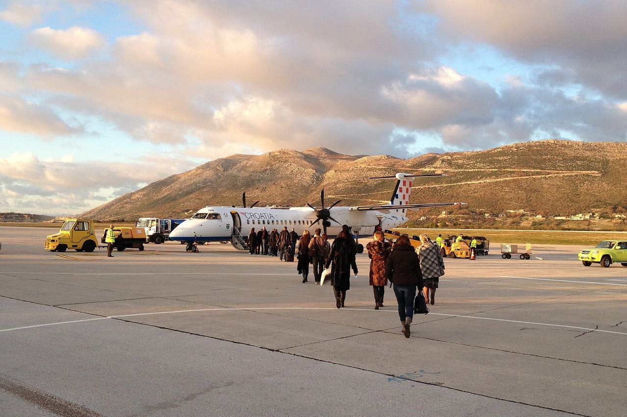 Passengers walking across the apron towards the terminal at Dubrovnik Airport