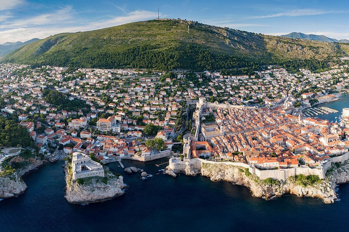 Aerial panorama of Dubrovnik's walled Old Town with Mount Srđ behind it