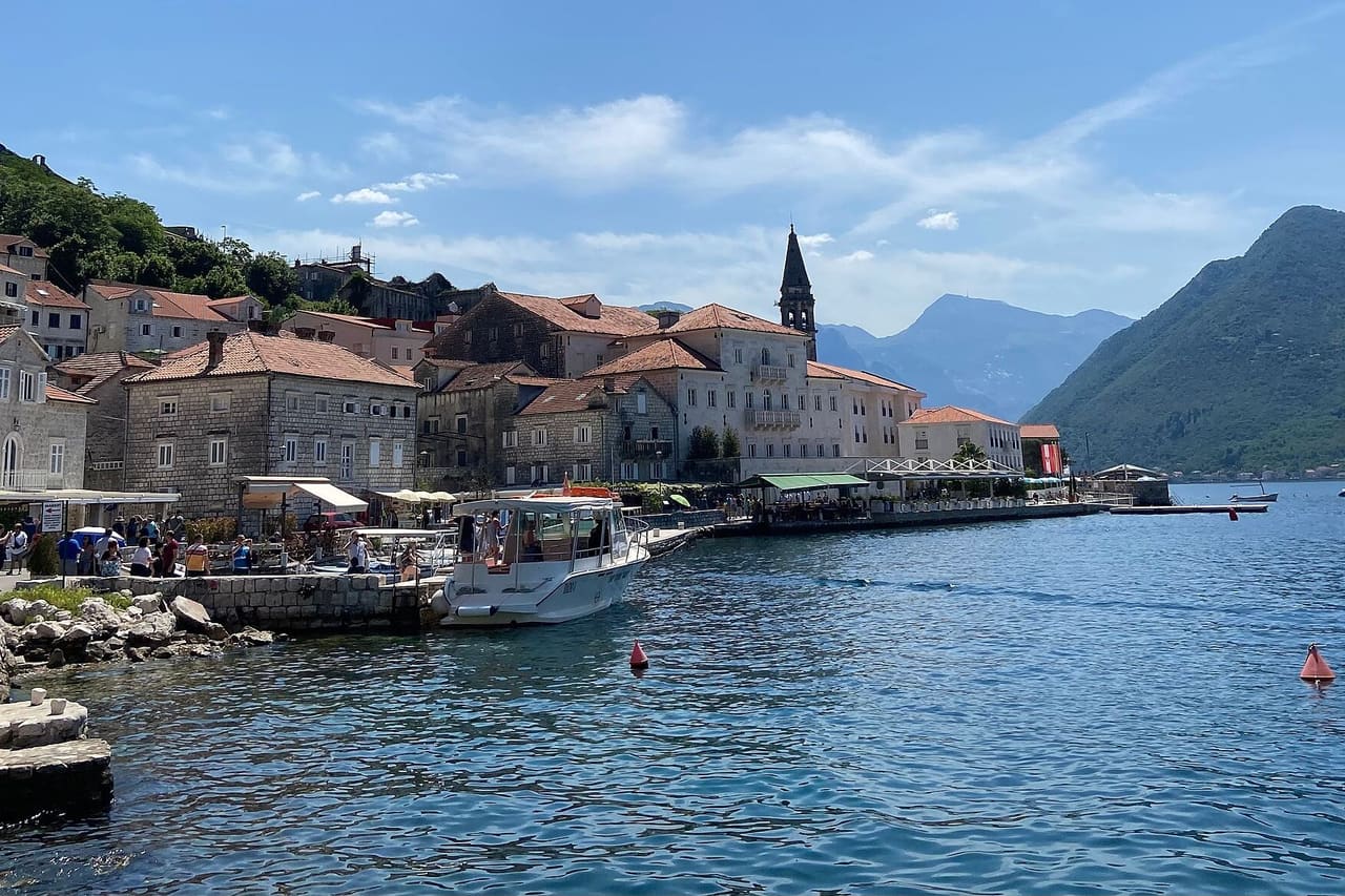 Stone houses and the bell tower of Perast on the Bay of Kotor, Montenegro