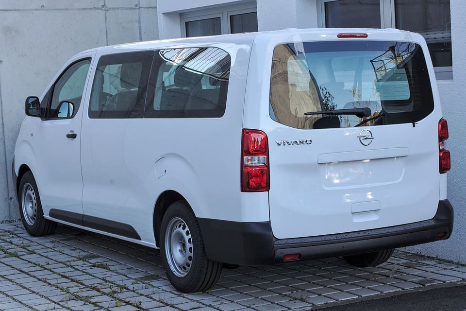 White Opel Vivaro passenger van, an example of the minivan class